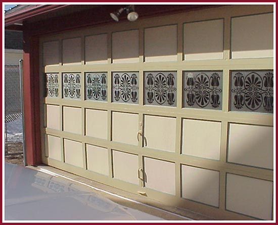 This garage door assumed a whole new personality with the addition of etched windows.