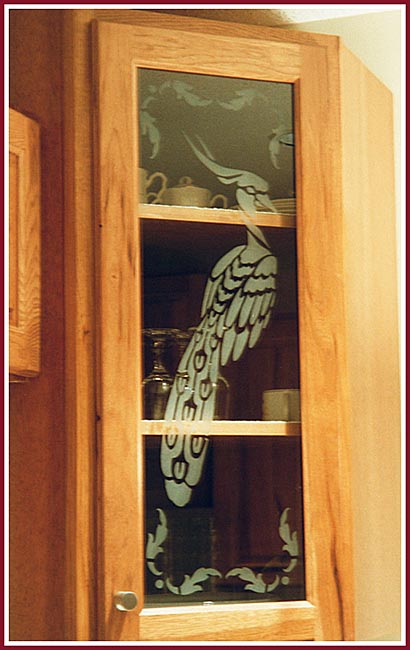 Etched glass Peacock in a cupboard or Butlers Pantry door.